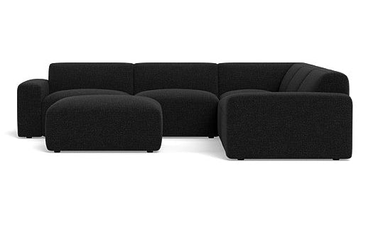 Black sectional sofa on a white background